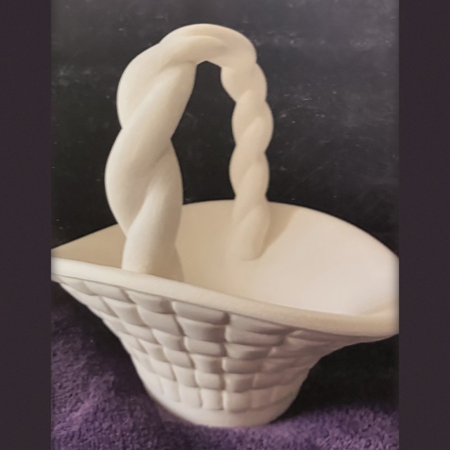 Basket, number 100, unpainted bisque on black velvet